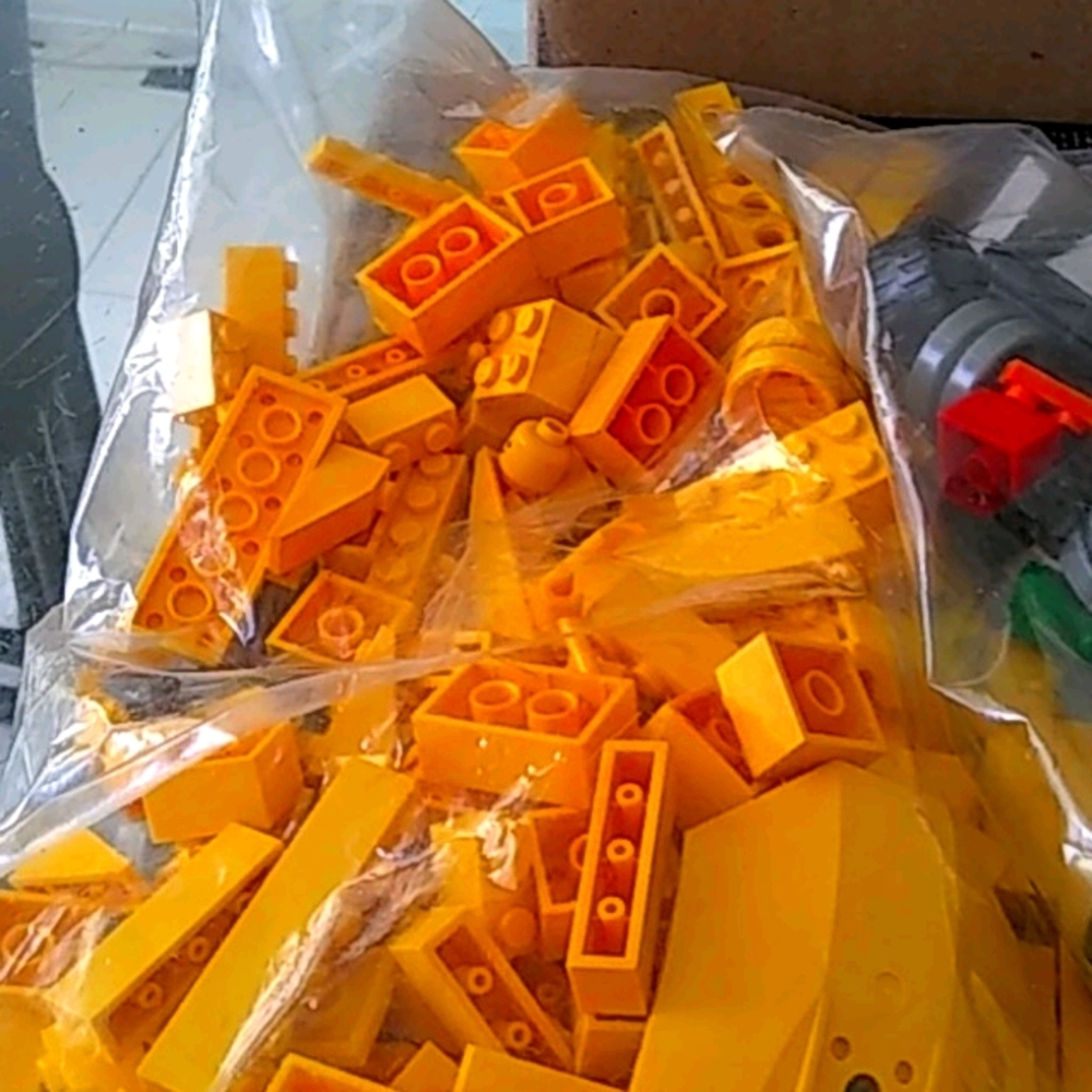 2 bags legos wheels ect rare pieces